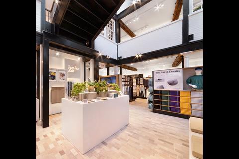 Interior of Uniqlo Covent Garden store showing product display and a sign reading: 'The Art of Detail'